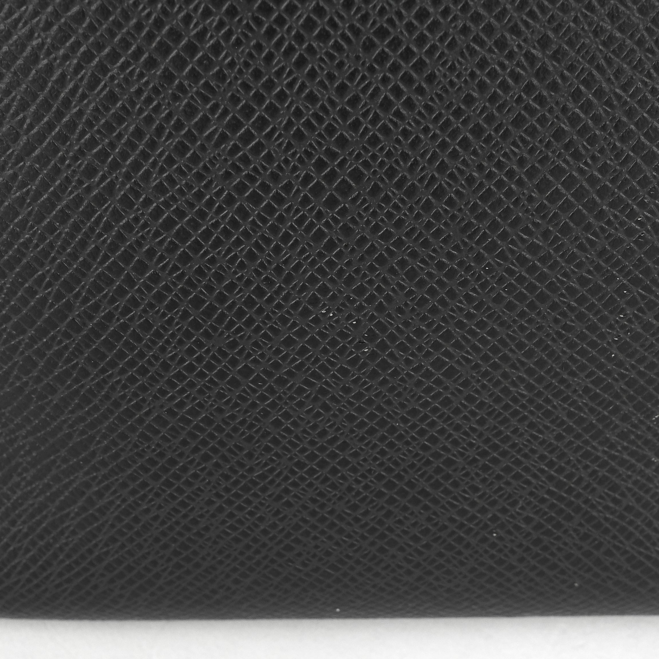 Louis Vuitto Roman MM Taiga Leather Messenger Bag
