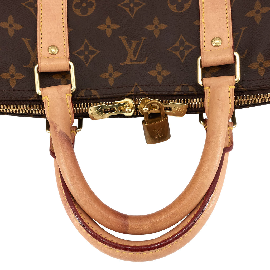 Louis Vuitto Keepall 55 Monogram Canvas Travel Bag