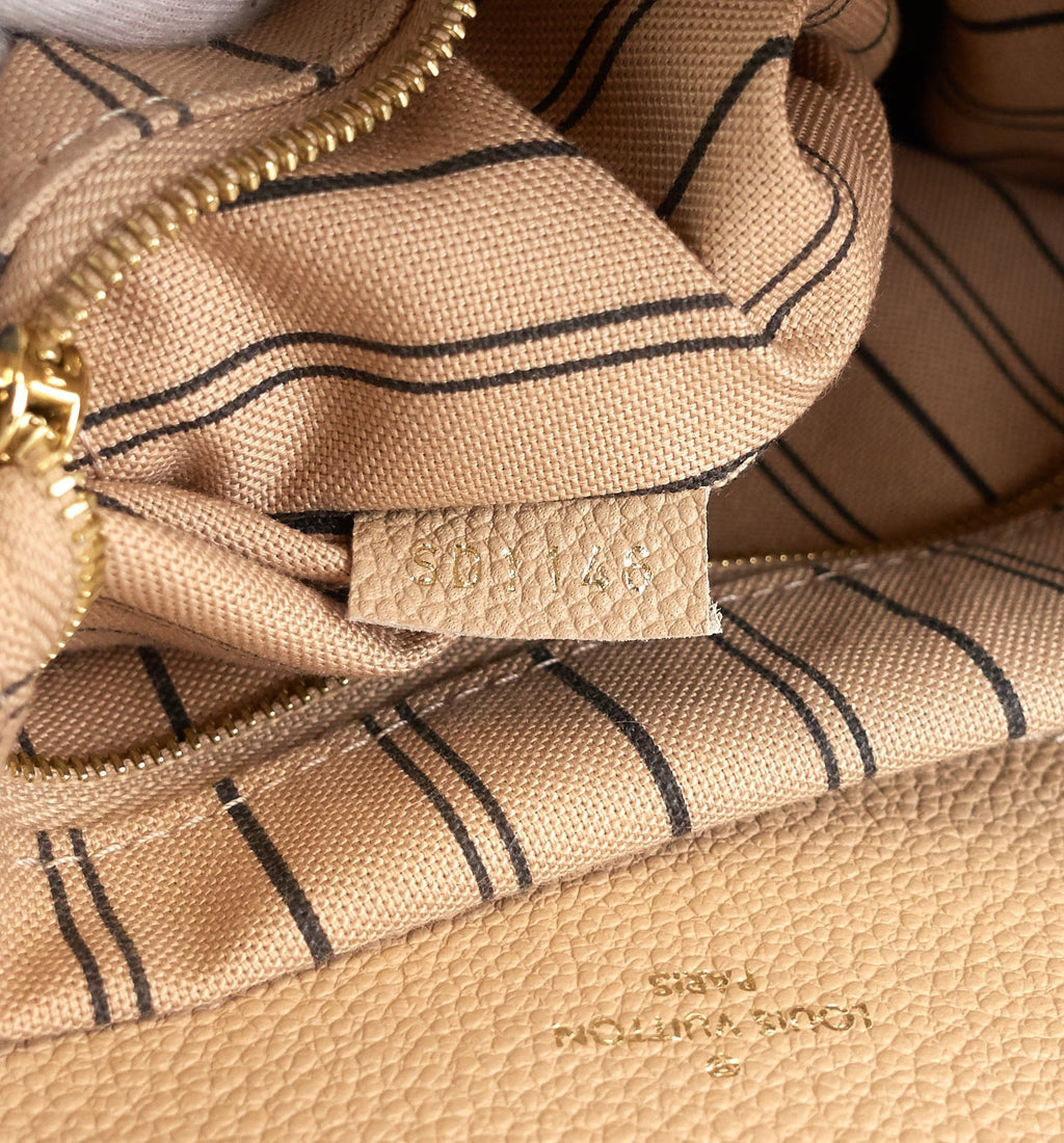 Louis Vuitto Bagatelle Monogram Empreinte Leather Hobo Bag
