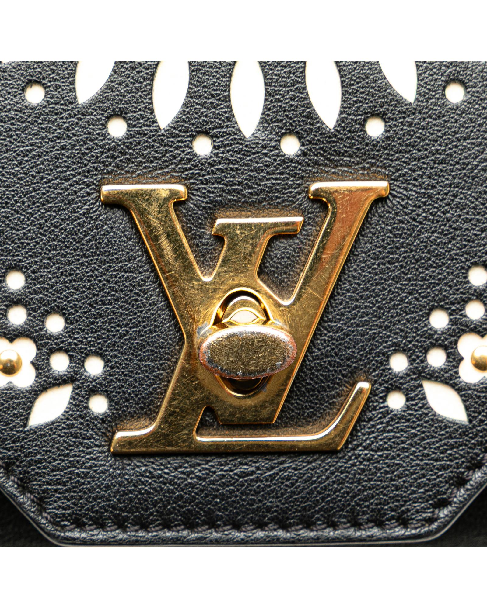 Embellished Leather Bag with Detachable Chain Strap and Twist Lock Closure