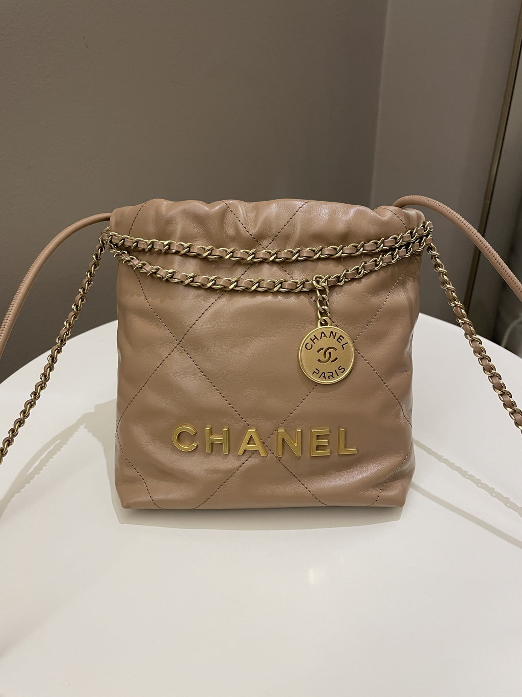 Chanel 23B 22 Mini Hobo Beige Calfskin