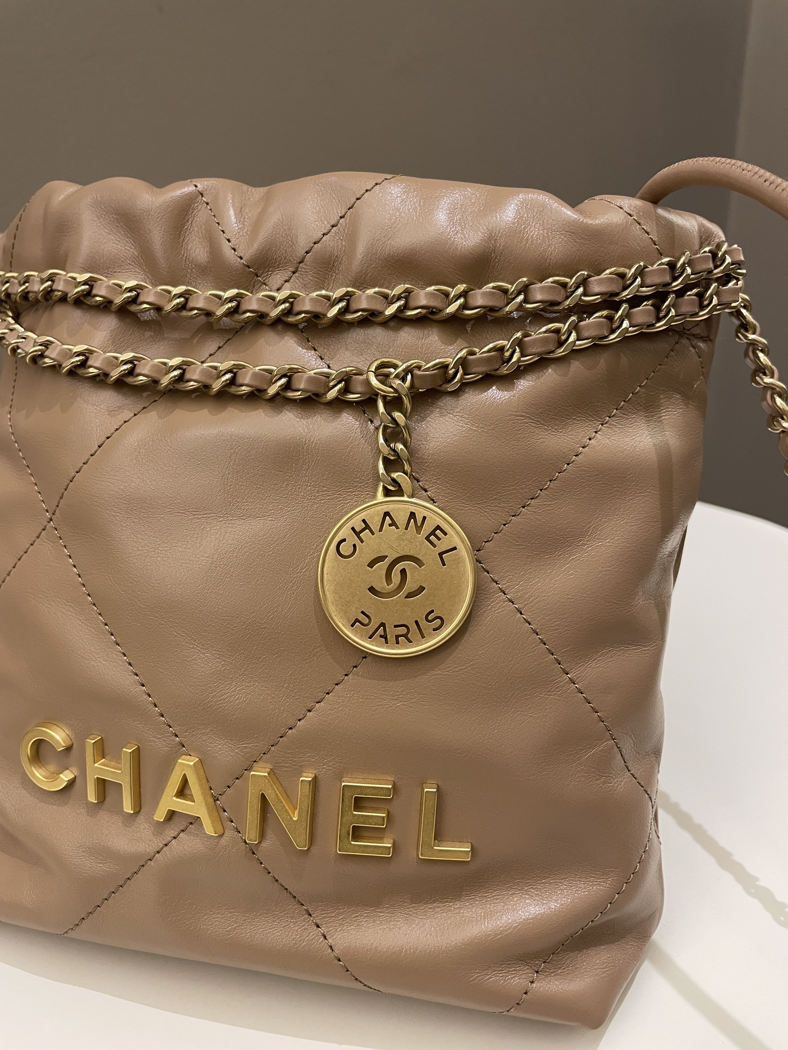 Chanel 23B 22 Mini Hobo Beige Calfskin