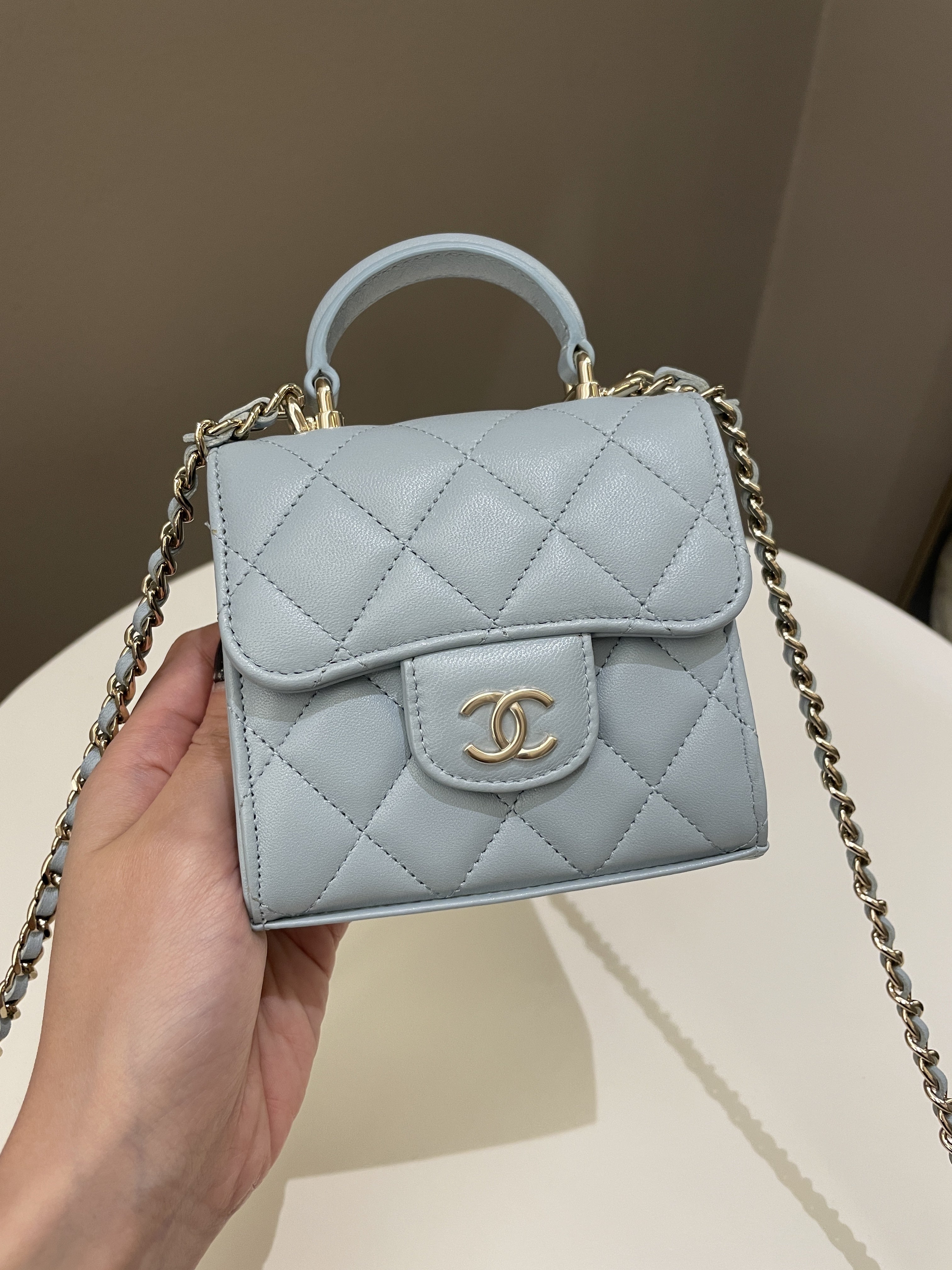 Chanel 22P Top Handle Clutch On Chain Baby Blue Lambskin