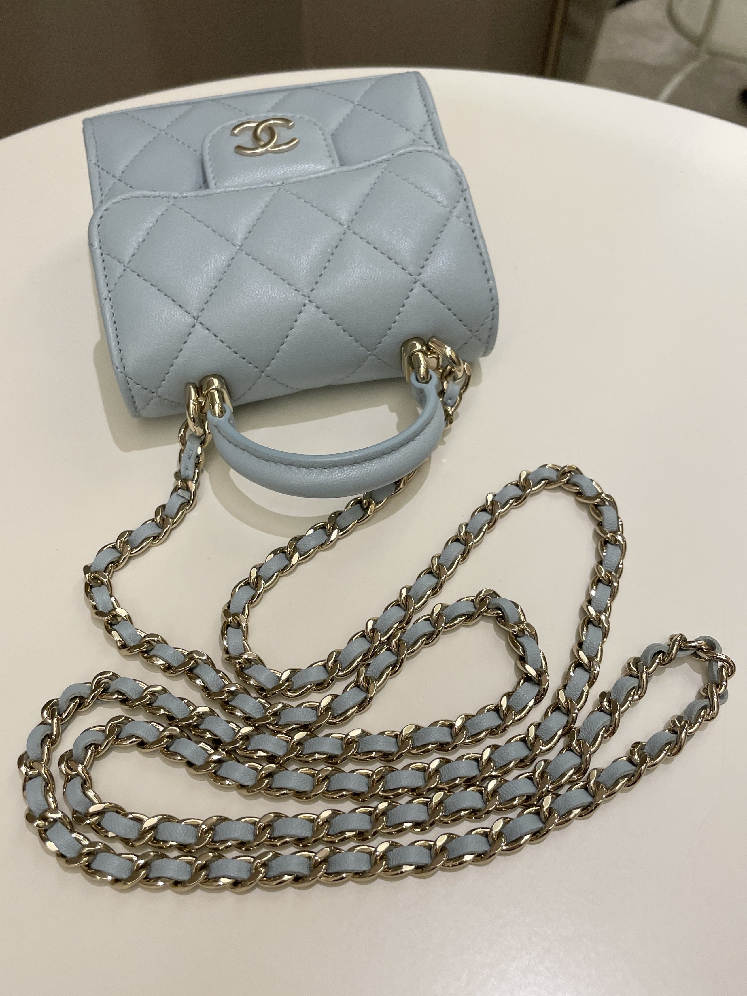Chanel 22P Top Handle Clutch On Chain Baby Blue Lambskin