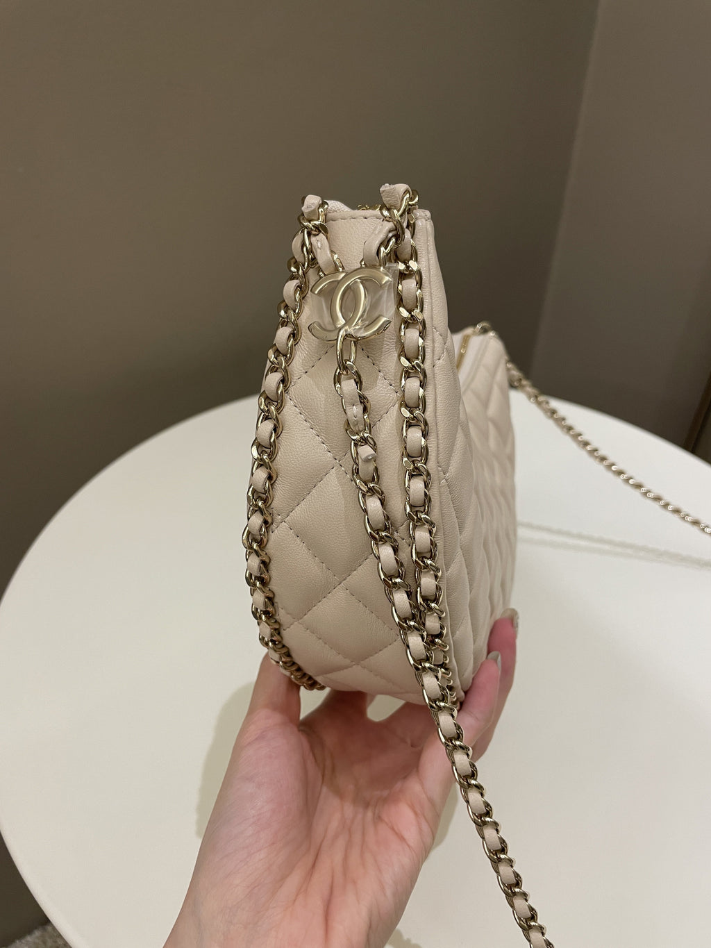 Chanel 23P Quilted Chain Around Hobo Bag Beige Lambskin