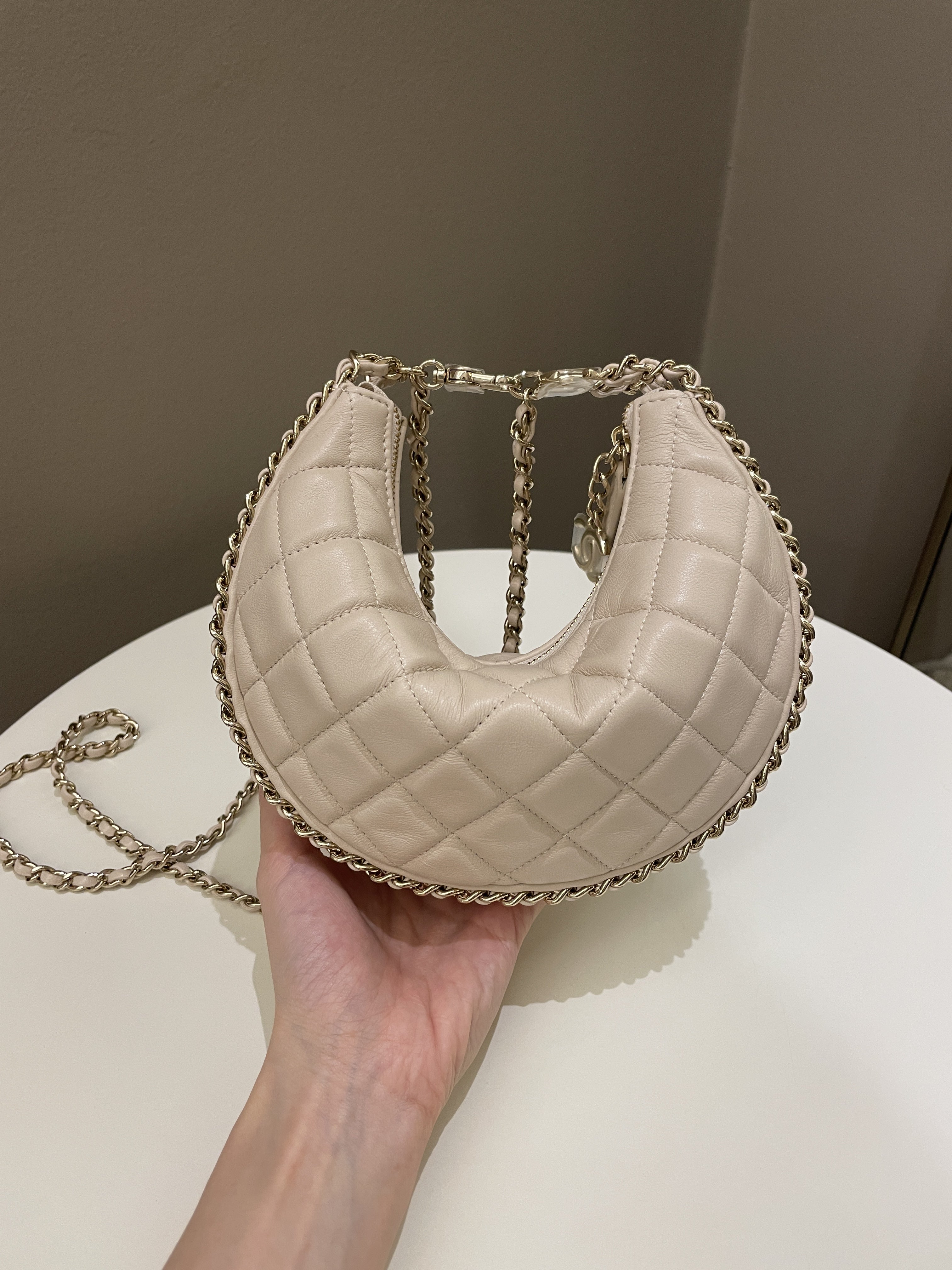 Chanel 23P Quilted Chain Around Hobo Bag Beige Lambskin
