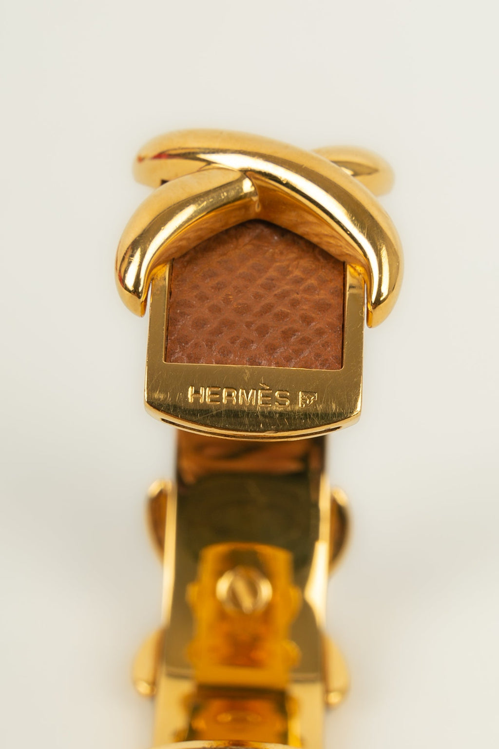 Bracelet en mÃƒÆ’Ã‚Â©tal dorÃƒÆ’Ã‚Â© et cuir HermÃƒÆ’Ã‚Â¨s