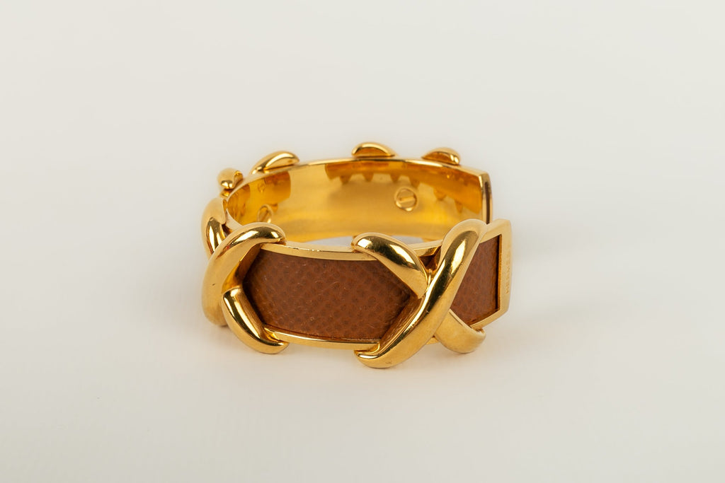 Bracelet en mÃƒÆ’Ã‚Â©tal dorÃƒÆ’Ã‚Â© et cuir HermÃƒÆ’Ã‚Â¨s