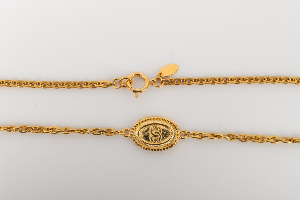 Collier / Sautoir en mÃƒÆ’Ã‚Â©tal dorÃƒÆ’Ã‚Â© Chanel 1980's