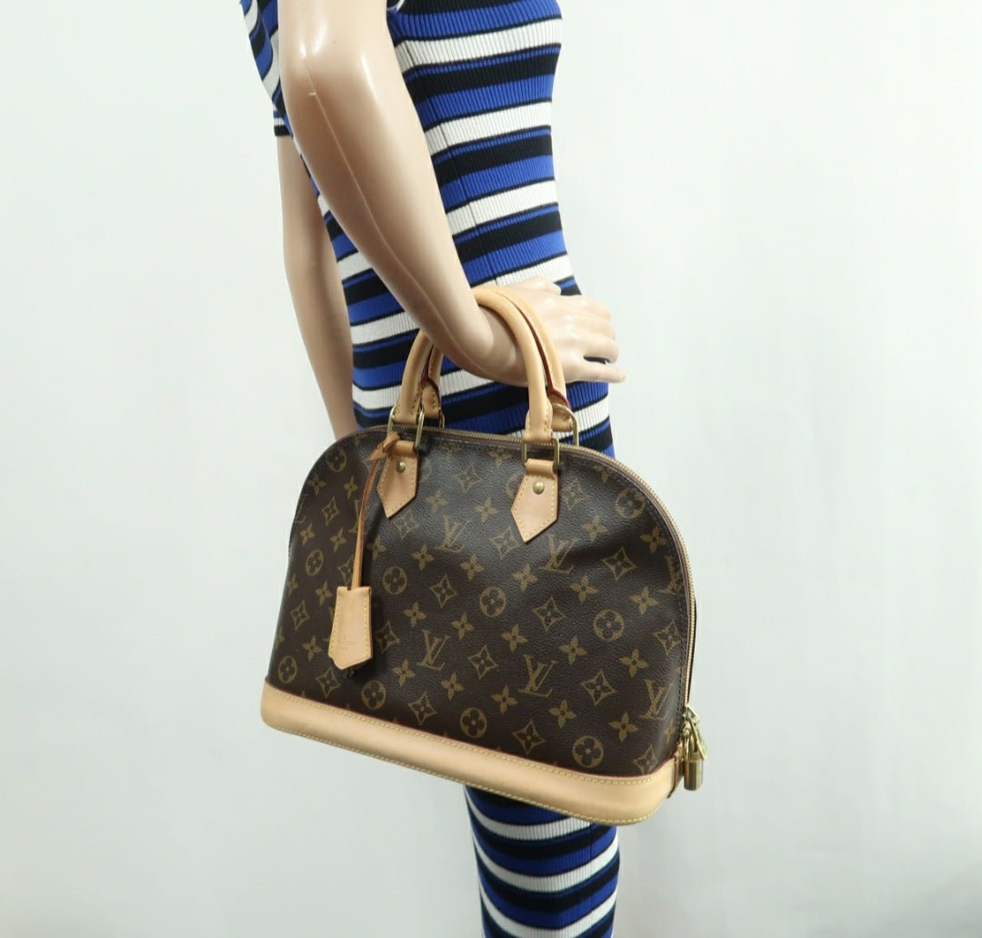 Louis Vuitton Alma Canvas Hand Bag