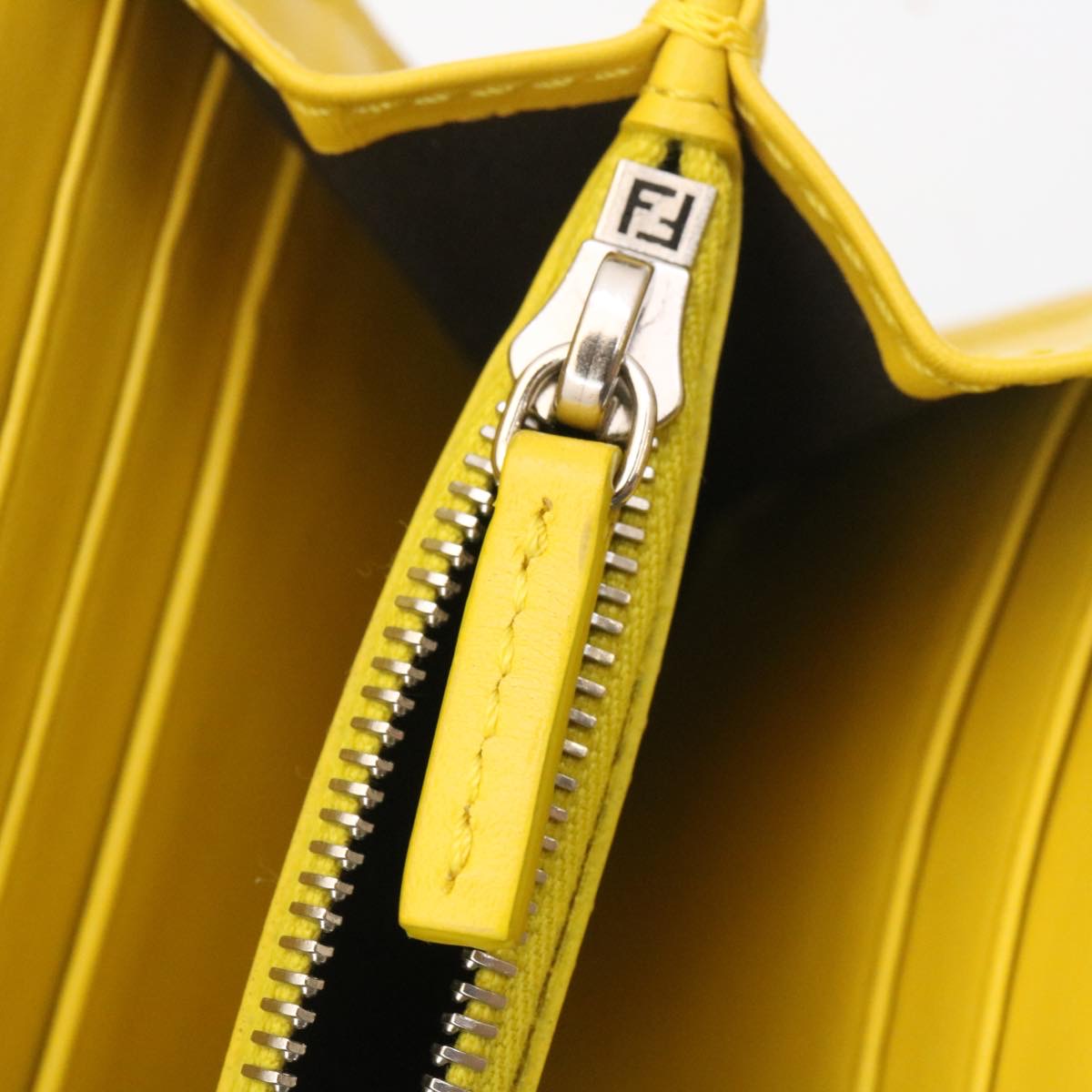 FENDI Zucca F is Continental Wallet Embossed Leather Yellow Brown 34531